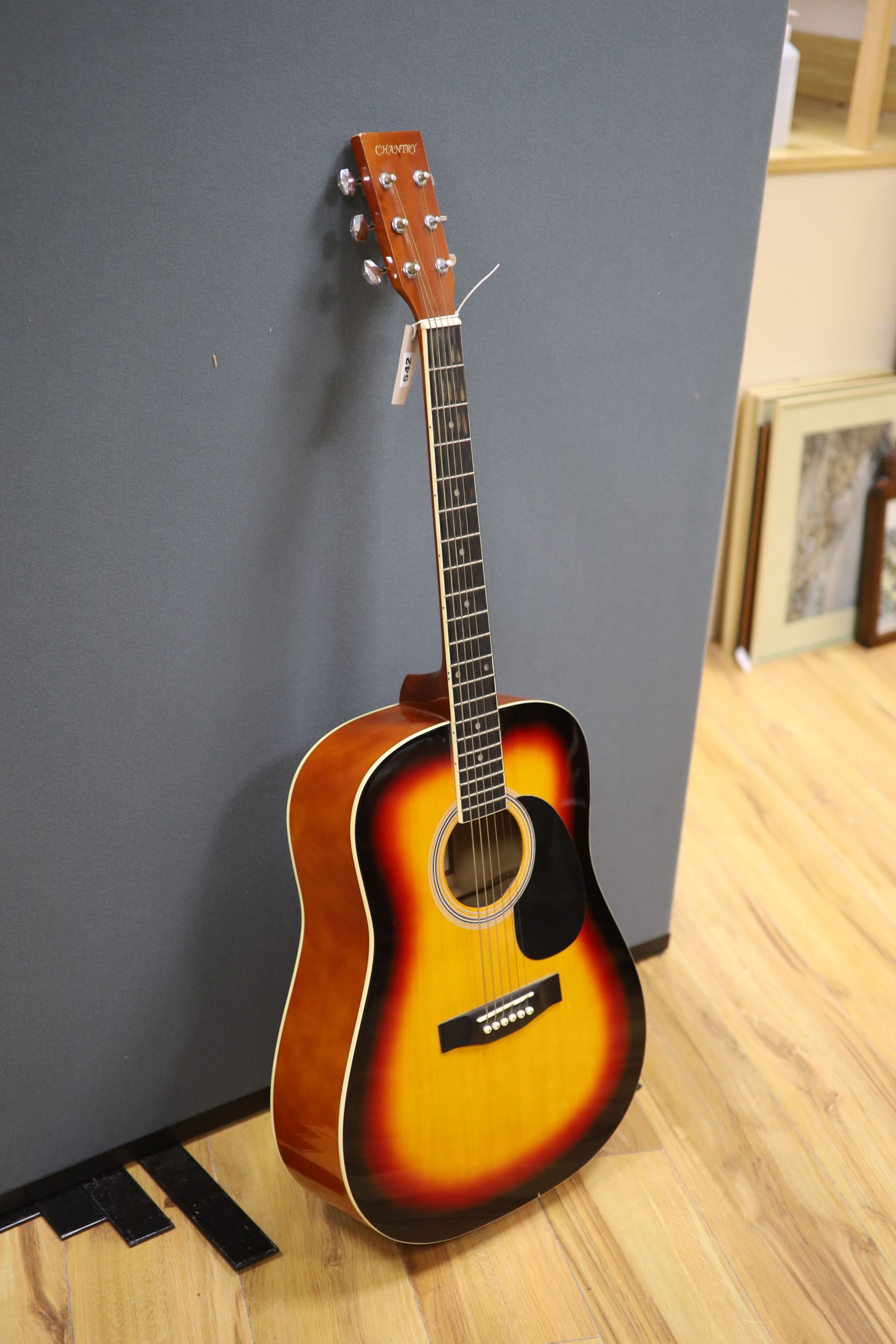 A Chantry Sunburst acoustic guitar